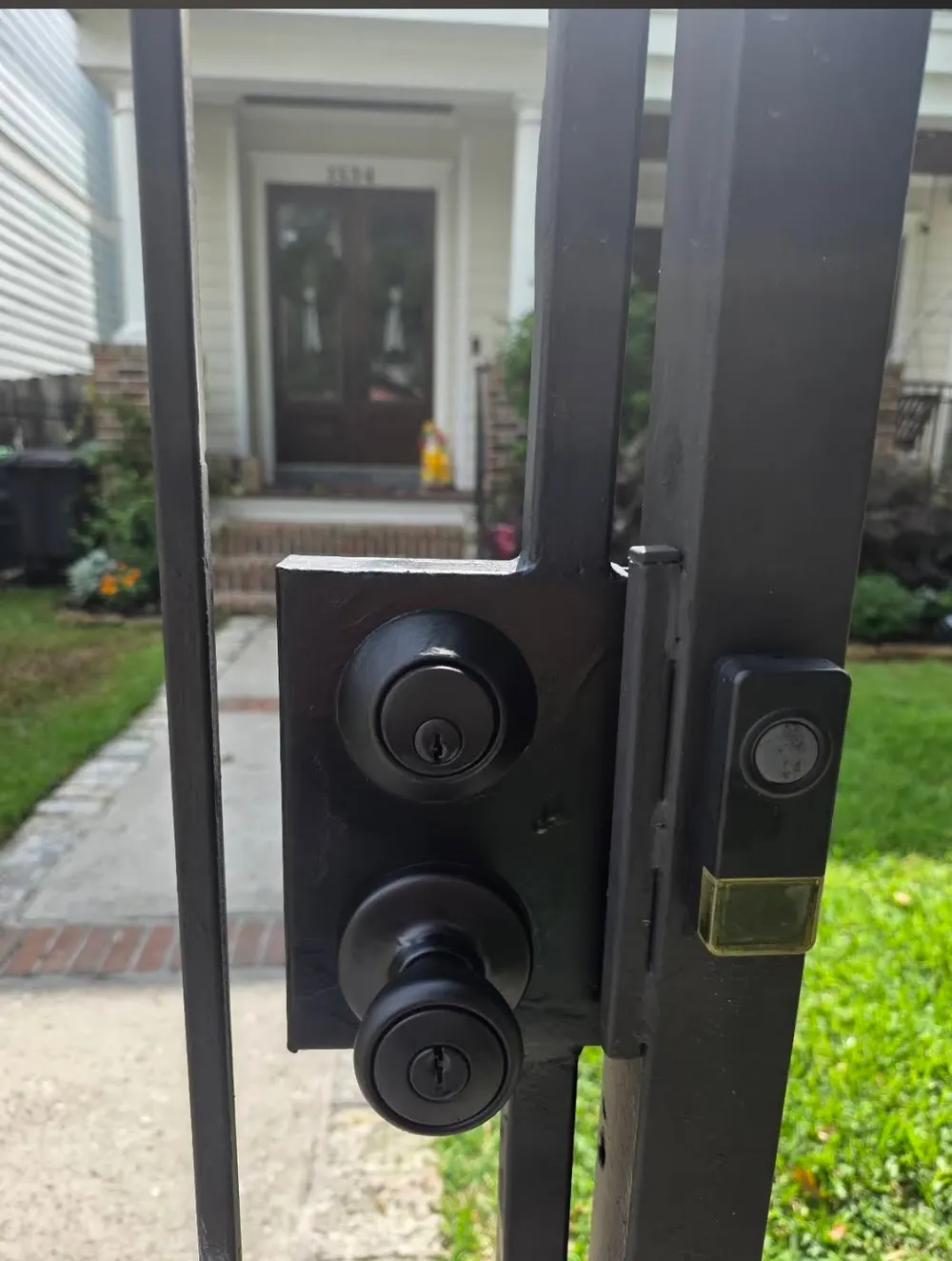 Custom gate lock hardware installed by Texas Gates in Houston Heights